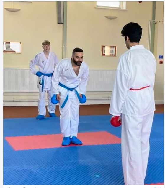Alessandro bowing to his partner before a kumite bout.