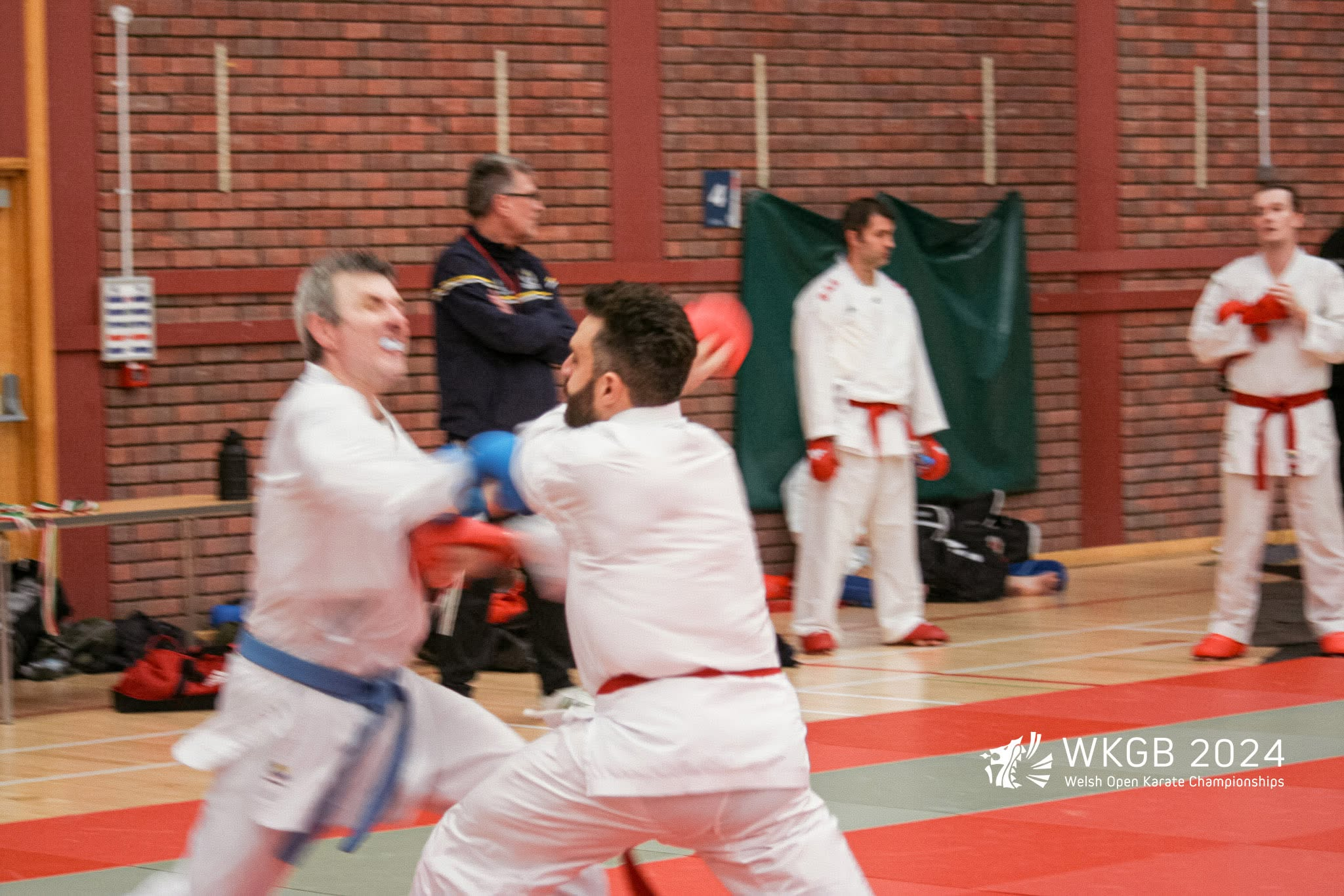 Alessandro exchanging techniques with his opponent during kumite at the 2024 WKGB Welsh Open.